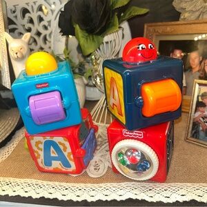 Fisher-Price 4 Bright Beginnings Stacking blocks 2015 and 2002 Mattel 3.5" x 3"